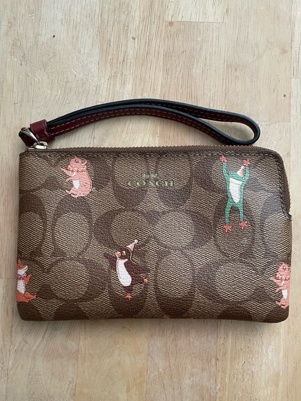 Party animal corner zip signature wristlet